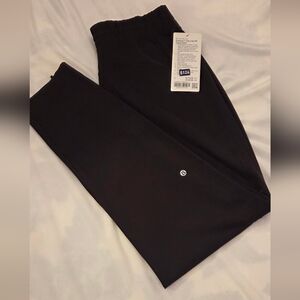 Lululemon Everlux Zip-Leg HR Track Pants in Sequoia and Light Ivory.